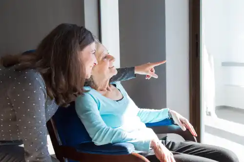 positive mother daughter enjoying dramatic view